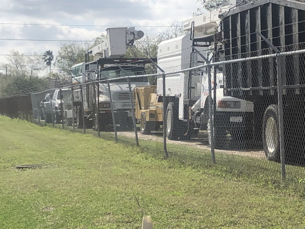 Lineup of Jarrett work trucks and equipment at the yard